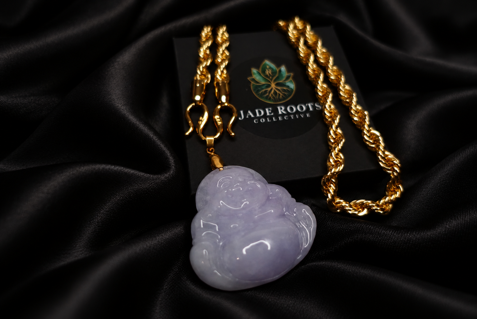 Lavender jadeite Buddha pendant with gold chain on black silk